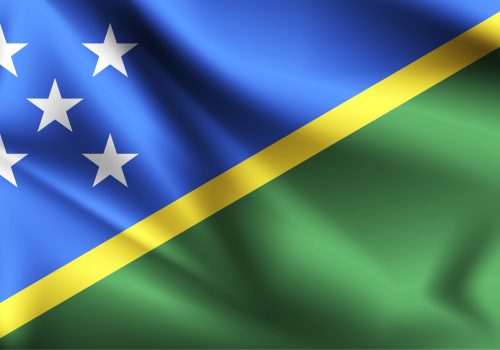 Solomon Islands flag blowing in the wind. part of a series. Solomon Islands waving flag.